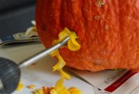 Wooden Serpents Slithering Through Carved Pumpkins