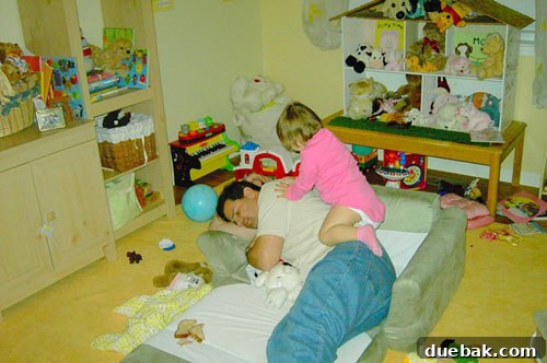 Cluttered playroom before transformation with toys and items scattered