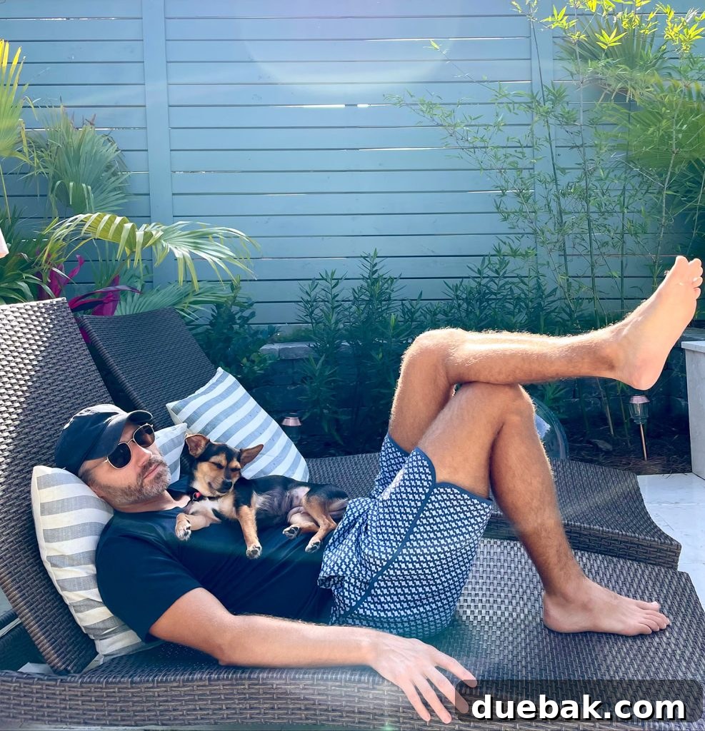 Penny and John sleeping together peacefully on a pool patio lounger, showing their strong bond