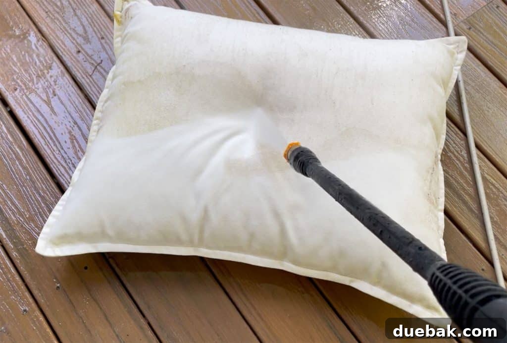 Essential Pressure Washer Tips For First Timers 20 Spraying Outdoor Pillow With Electric Pressure Washer