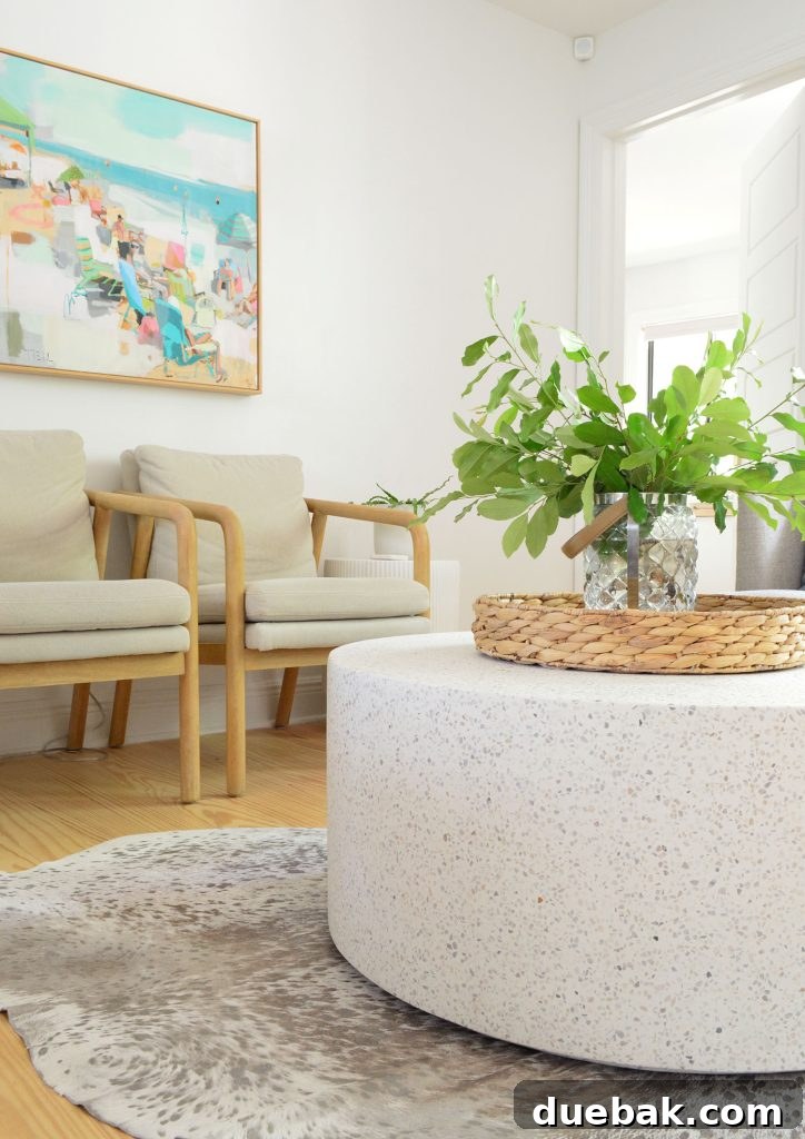 Detail of the round terrazzo stone coffee table in the seating area, showcasing its material and texture.