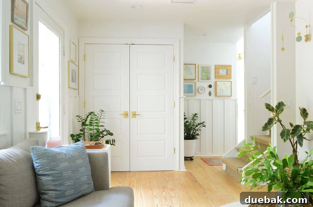 View of the discreet laundry closet next to the seating area, demonstrating hidden functionality.