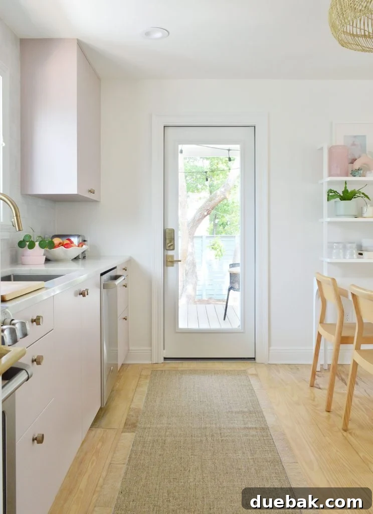 View Towards Kitchen Porch Door In Painted Mauve Pink Ikea Kitchen With Jute Runner