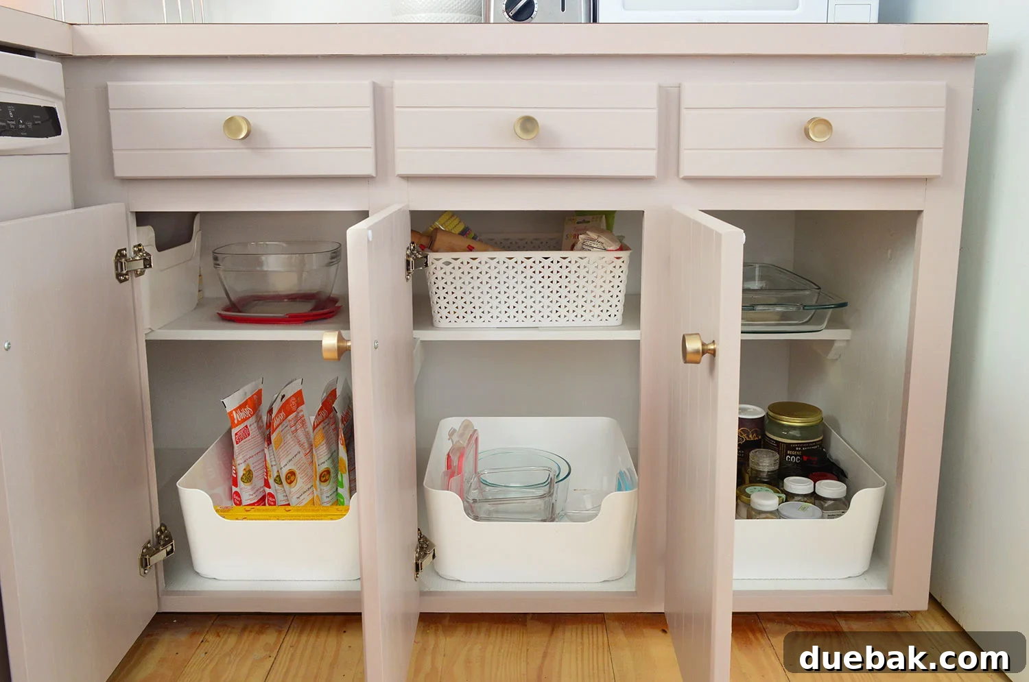 Three Lower Cabinet Opened To Show Narrow Storage Capabilities