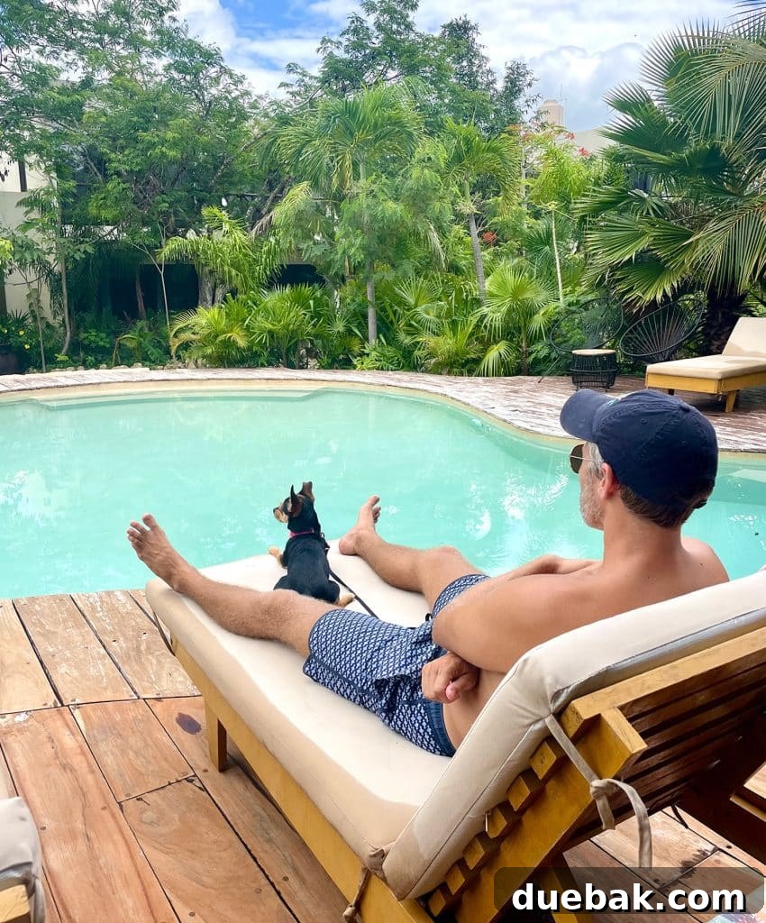 John Sitting By Pool In Akumal With Penny The Dog