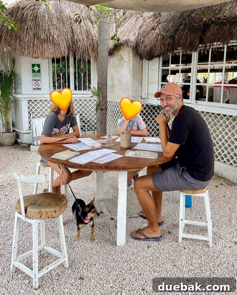 Dining Outdoors in Tulum Mexico With Dog Under Table