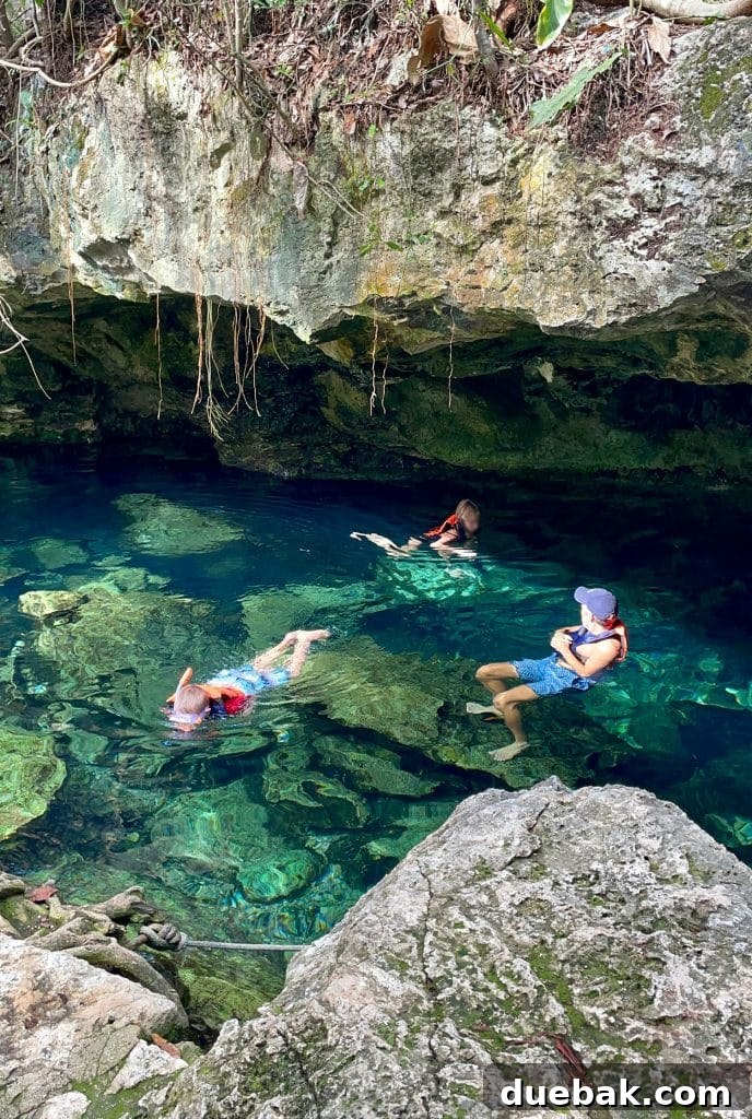 Kids Swimming in Cenote In Yucatan Mexico