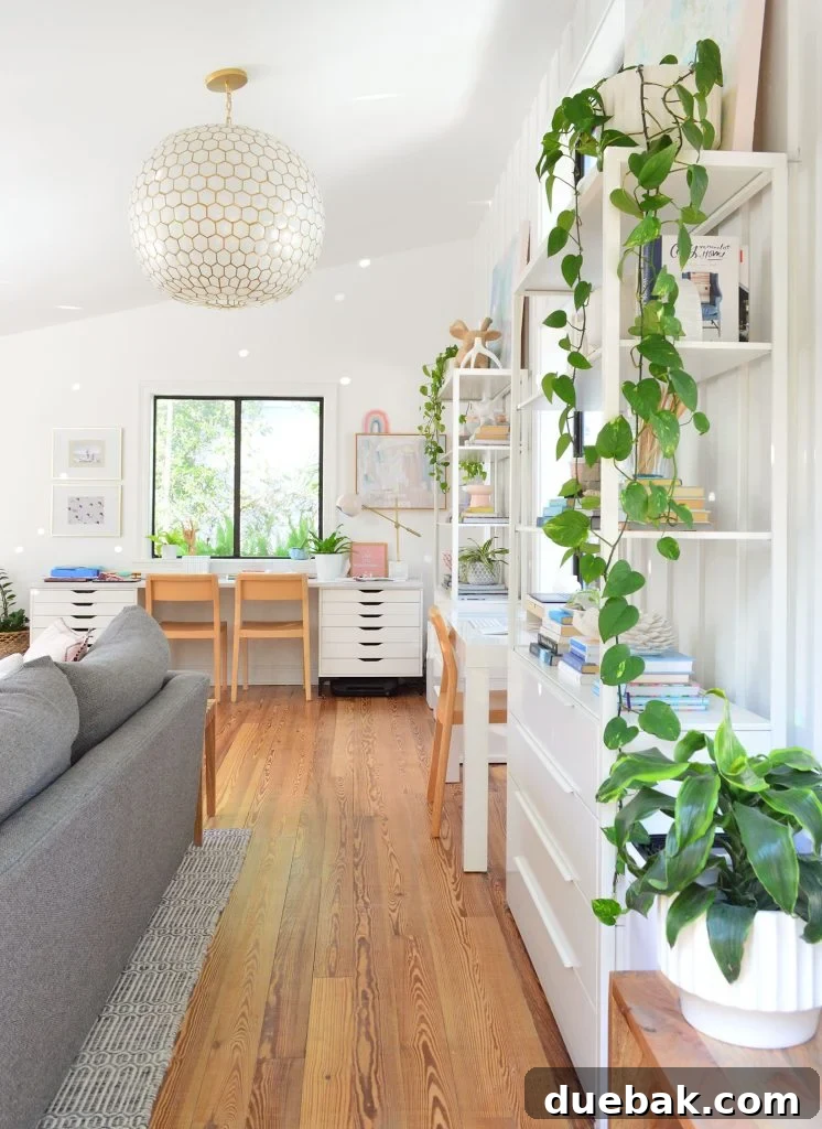 Upstairs family room with plants and Serena & Lily capiz pendant light
