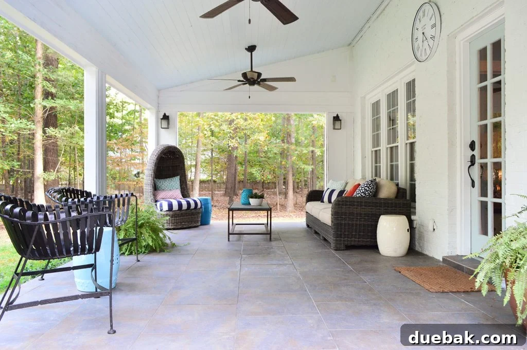 Cover sunroom patio with tile floor and vaulted blue ceiling