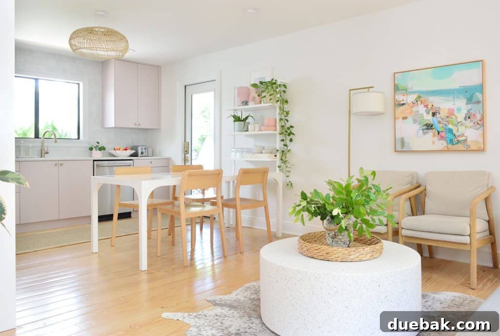 Seating Area With Round Coffee Table Next To Mauve Ikea Kitchen