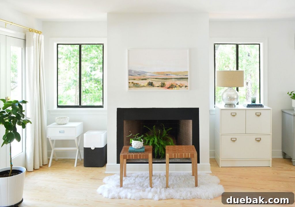 Bedroom fireplace shortly after moving with random furniture along the wall