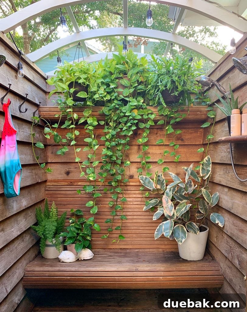 Wood Slatted Outdoor Shower With Cascading Hanging Plants
