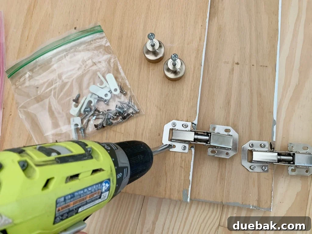 Upgrade Your Old Cabinets with Invisible Hinges 9 Screwing hidden hinges on backs of wood cabinet doors