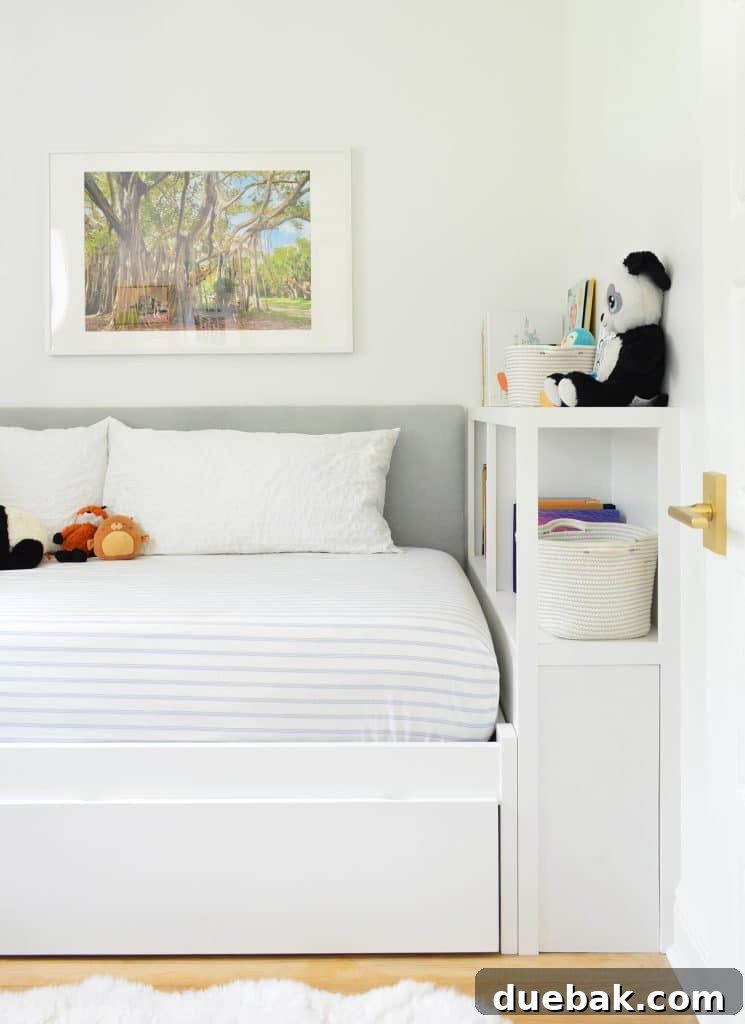 Boys bedroom featuring a stylish custom fabric headboard and a newly built-in bed with a versatile bookcase footboard, showcasing smart small-space design solutions.