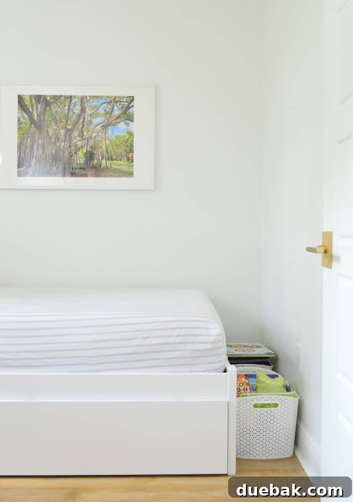 Before photo of a boy's bedroom, showing disorganized baskets on the floor near the foot of the bed, highlighting the pressing need for better storage solutions.