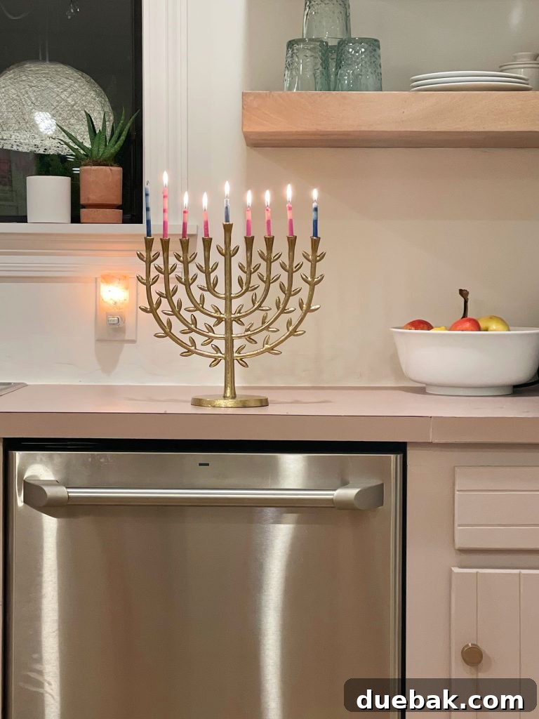 A elegant brass Menorah displayed prominently on a kitchen counter, symbolizing the celebration of Hanukkah during the holiday season.