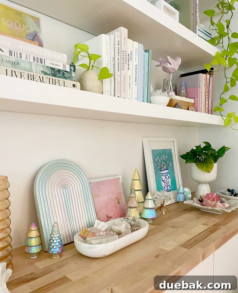 Decorated floating shelves showcasing a charming arrangement of small decorative iridescent Christmas trees, adding a magical glow and modern flair to holiday decor.