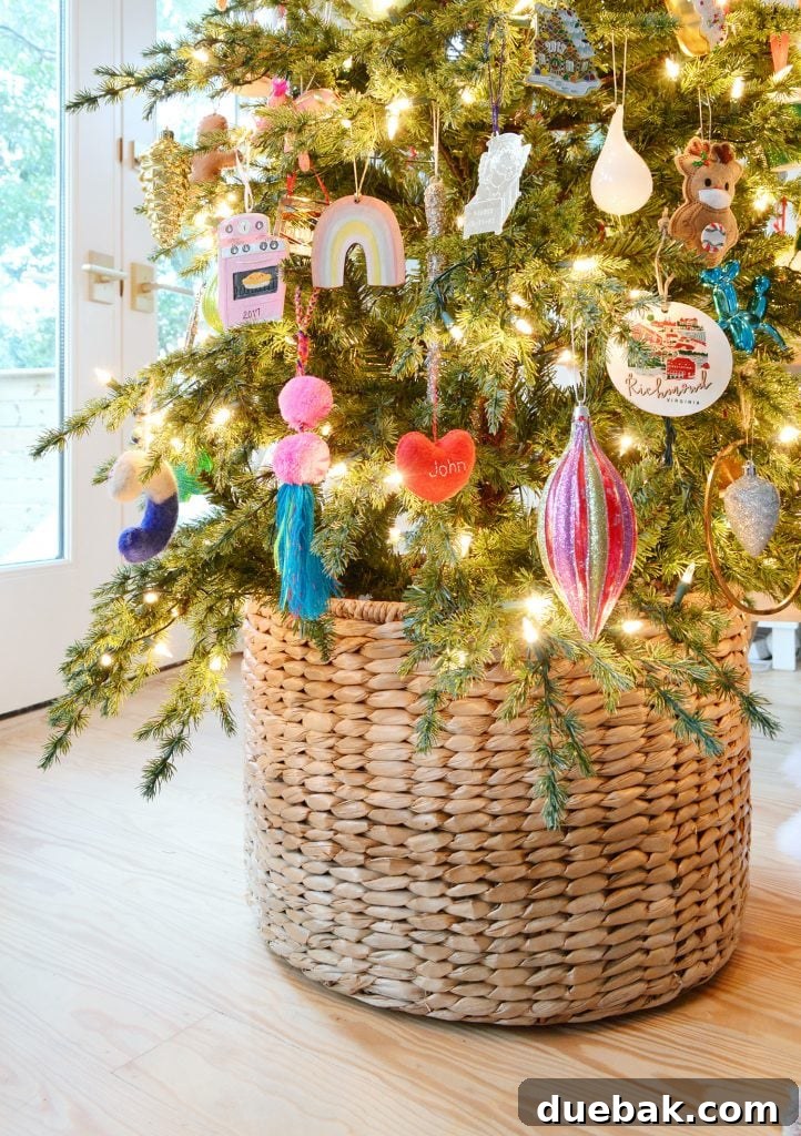 A festive Christmas tree with colorful ornaments, nestled into a decorative woven basket at its base, enhancing its charm and concealing the stand.