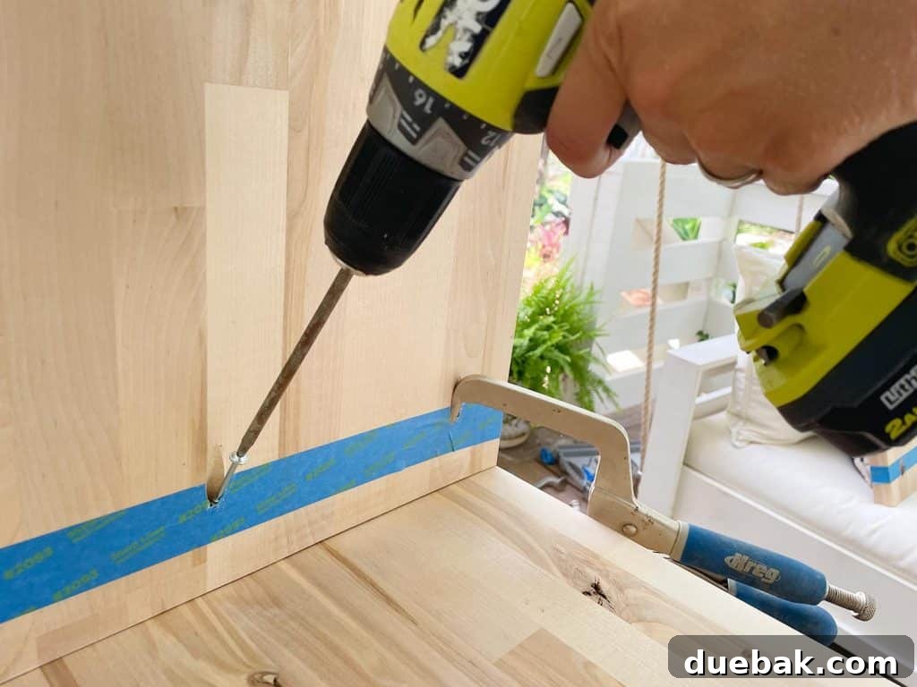 Elevate Your Bedroom with DIY Modern Nightstands 12 Attaching Nightstand Leg Using Pocket Hole Screw From Inside for a Seamless Look