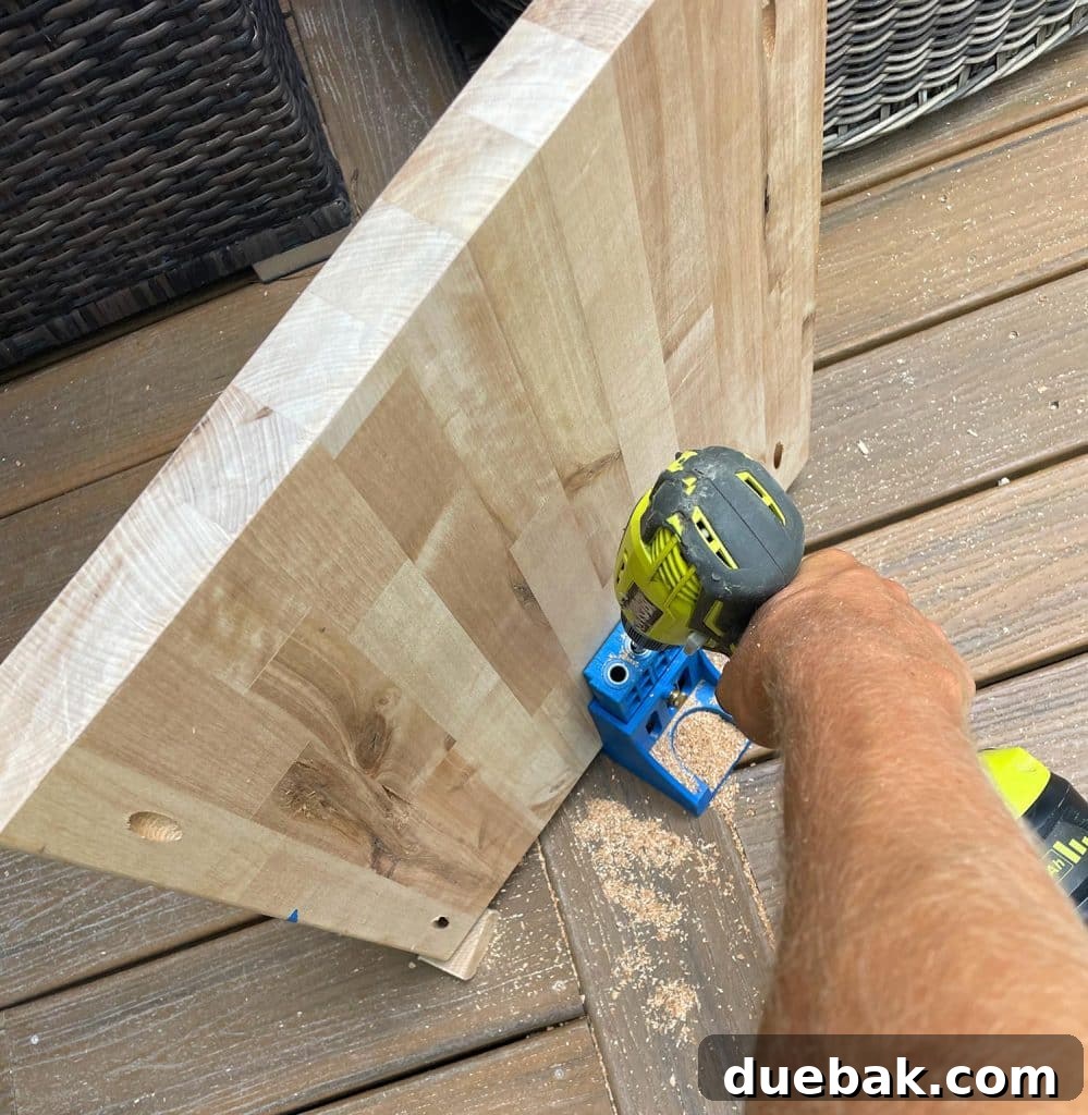 Elevate Your Bedroom with DIY Modern Nightstands 13 Drilling Pocket Holes Into Nightstand Shelf Using Kreg Pocket Jig on Underside