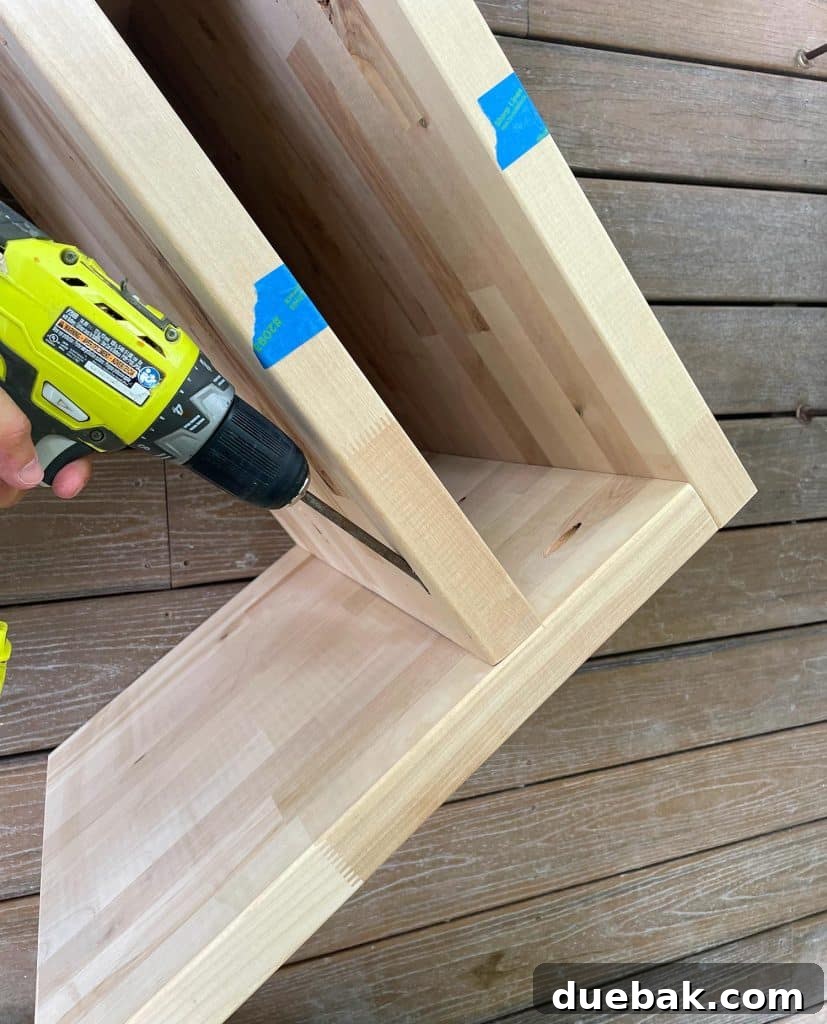 Elevate Your Bedroom with DIY Modern Nightstands 14 Attaching Shelf Inside Butcher Block Nightstand DIY Build with Hidden Screws