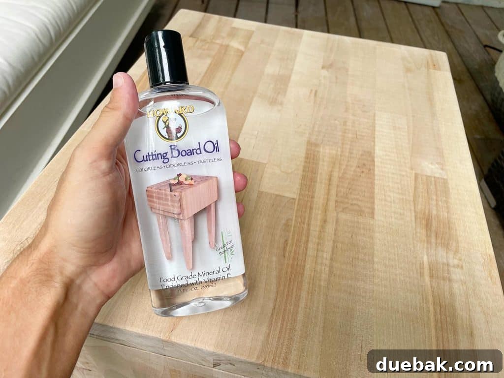 Elevate Your Bedroom with DIY Modern Nightstands 17 Cutting Board Oil Bottle Before Applying To DIY Butcher Block Nightstands for Protection