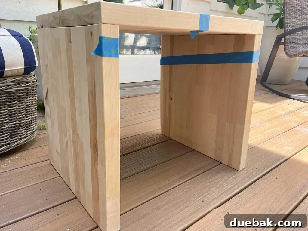 Elevate Your Bedroom with DIY Modern Nightstands 9 Pieces of Butcher Block DIY Nightstand Laid Out And Marked With Tape for Assembly
