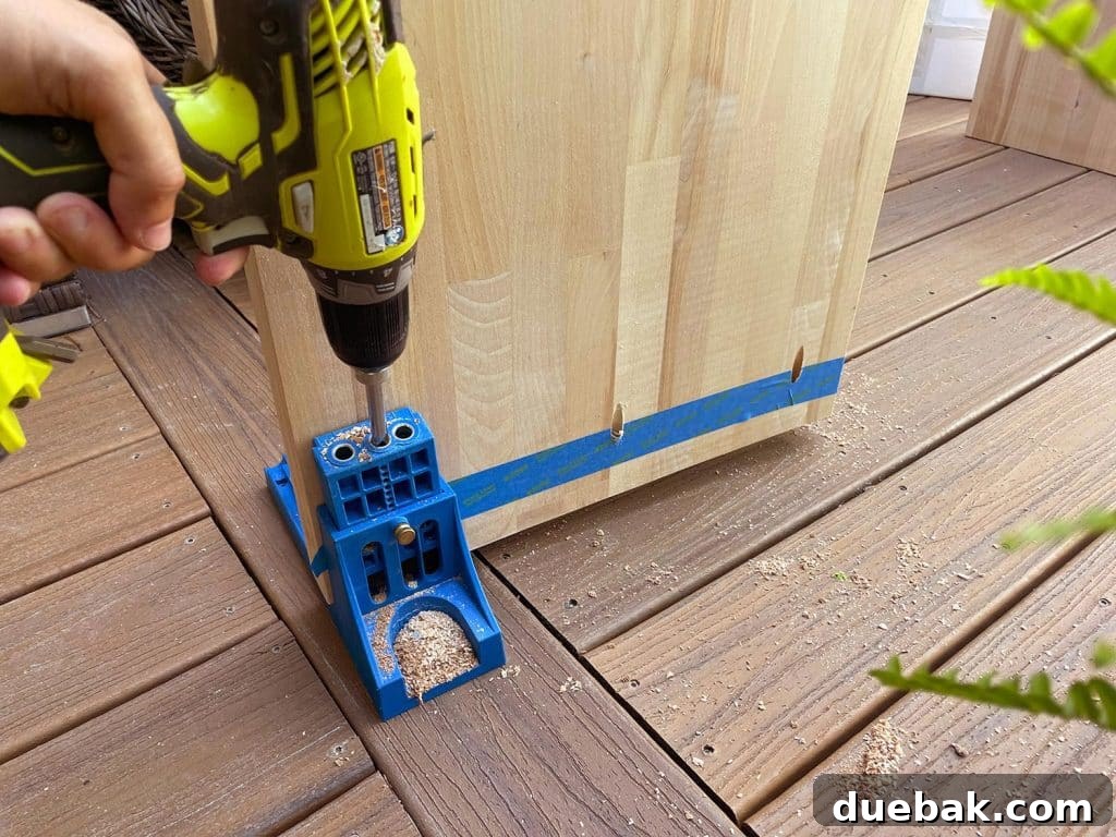 Elevate Your Bedroom with DIY Modern Nightstands 10 Drilling Pocket Hole Into Butcher Block Using Kreg Jig for a Hidden Joint