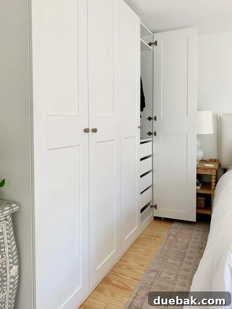 Open Closet Door To Ikea Pax Wardrobe System Next To Bed