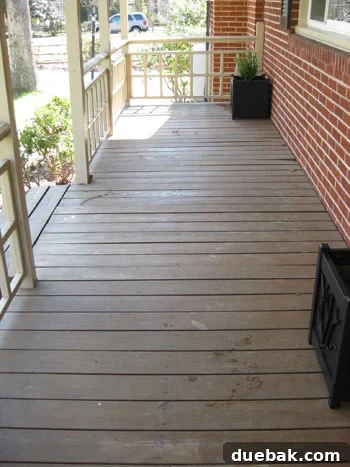 Before cleaning: A wood porch with some debris, ready for preparation