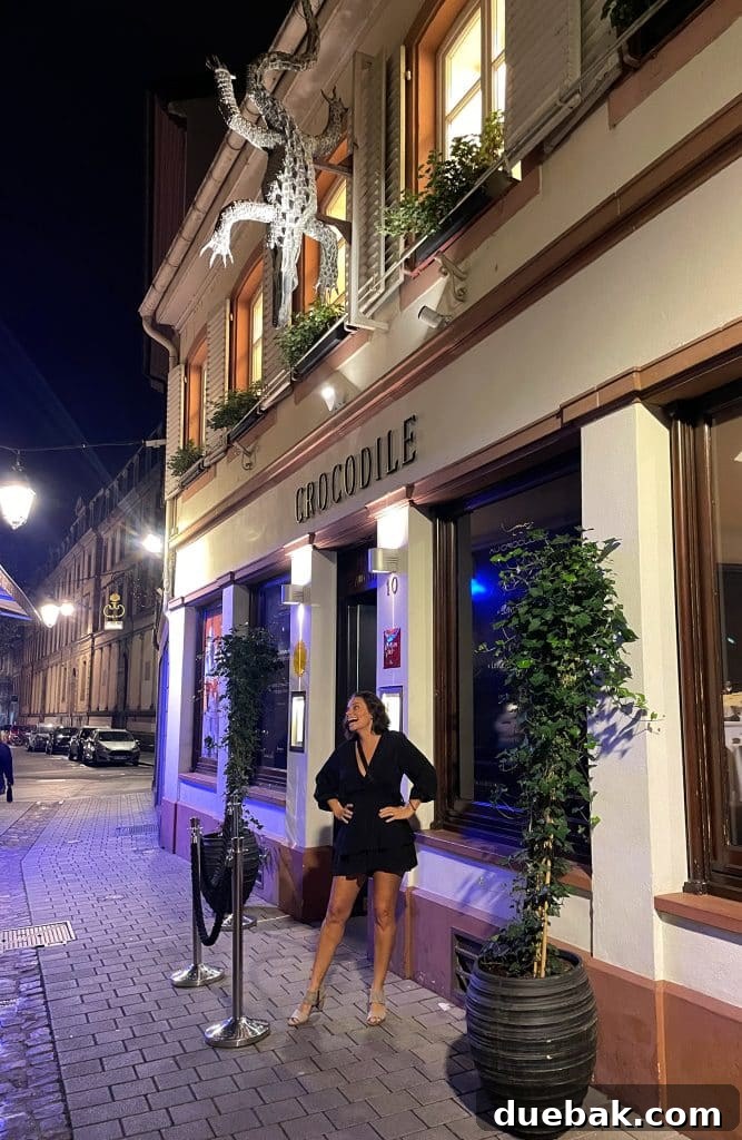 Parisian Chic Packing Secrets 14 Sherry outside Crocodile restaurant in short black dress
