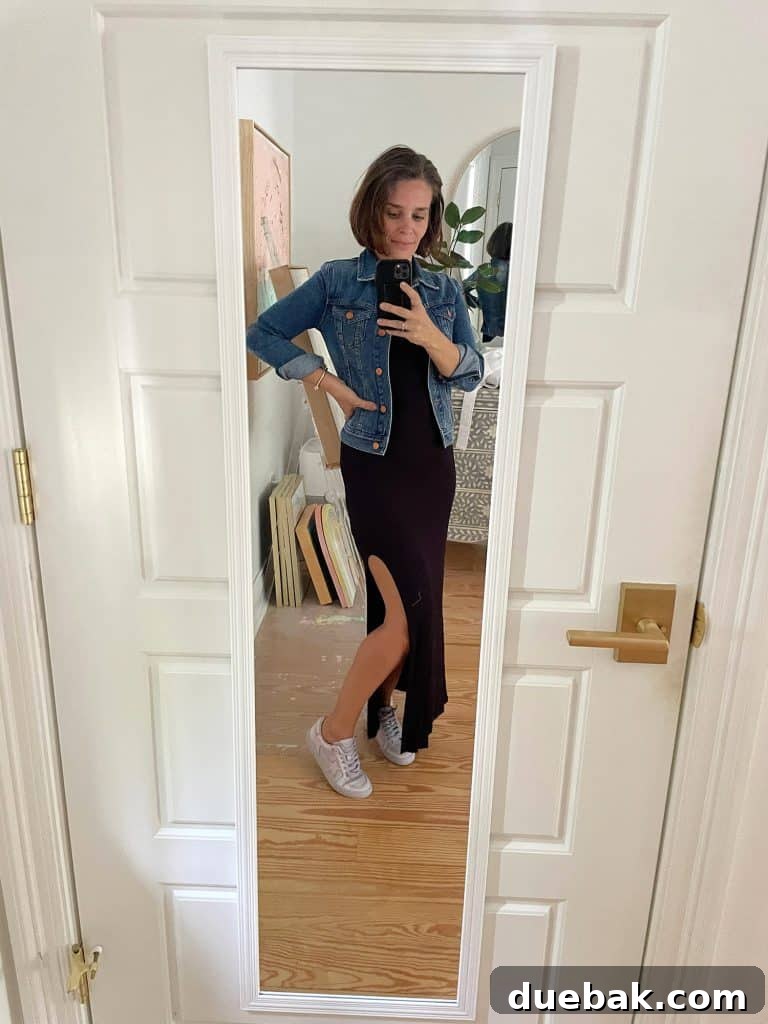 Parisian Chic Packing Secrets 15 Sherry selfie in mirror at home with long black dress and jean jacket and tennis shoes
