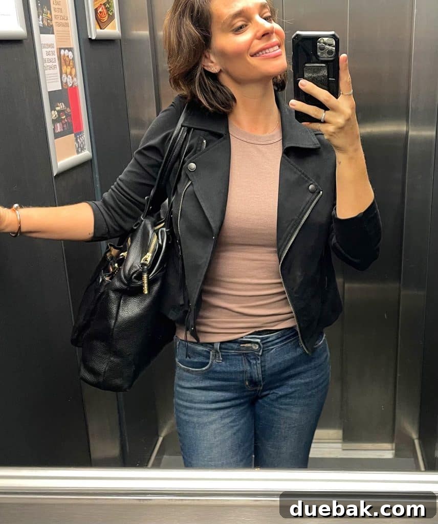 Parisian Chic Packing Secrets 19 Sherry selfie in elevator with tan tank top and black leather jacket and jeans