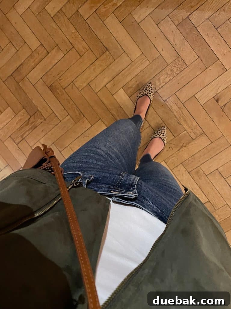 Parisian Chic Packing Secrets 22 Sherry wearing white tank with green jacket and jeans with leopard print shoes