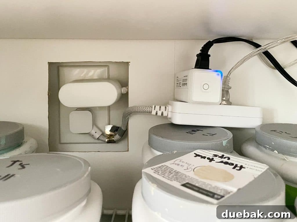 Detail of Plugs And Wires Within Ikea Besta Storage Unit