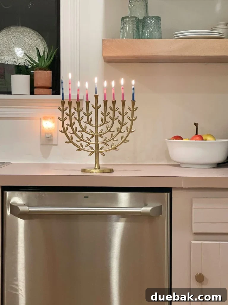 Joyful Simplicity: Our Holiday Edit 16 Elegant gold leafy menorah on a kitchen table, symbolizing new family holiday traditions