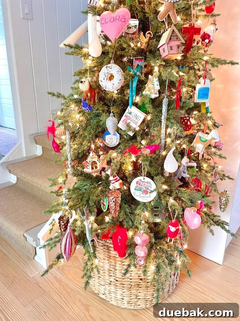 Joyful Simplicity: Our Holiday Edit 6 Close-up of eclectic, sentimental ornaments on a narrow Christmas tree in a wicker basket