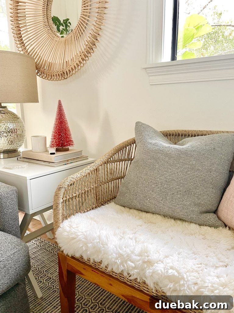 A stylish woven loveseat featuring a custom DIY sheepskin upholstered seat, adding comfort and a touch of luxury to the living space.