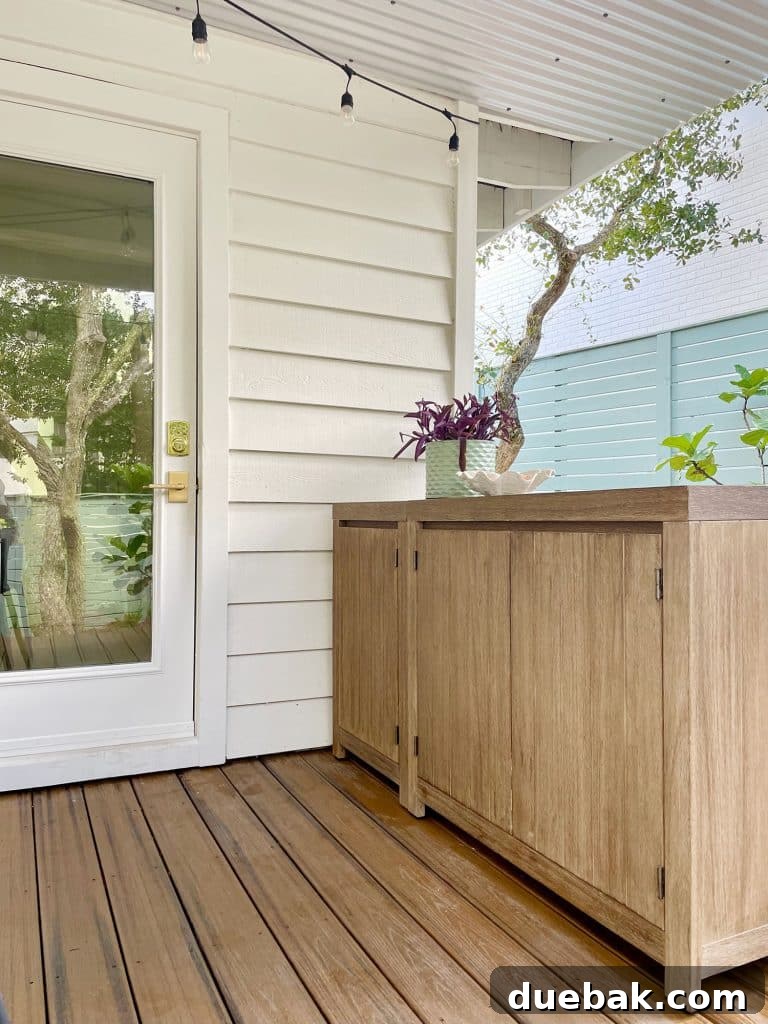 Close Up Of West Elm Portside Outdoor Cabinets Placed Outside Kitchen Door, demonstrating practical outdoor storage.