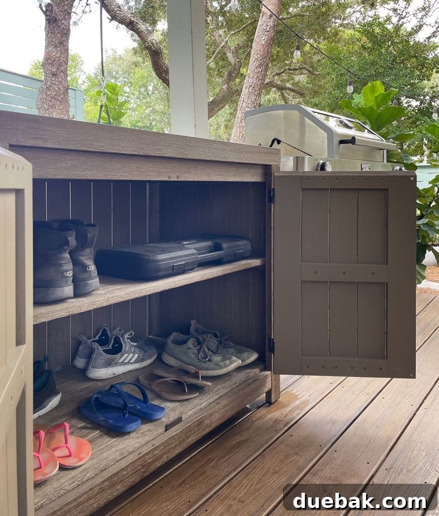 West Elm Portside Outdoor Cabinet Open To Show Shoe Storage, revealing the organized interior.