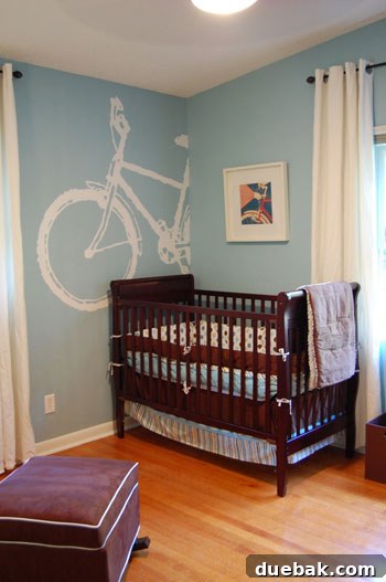 Wheels on the Wall Blue Nursery 3 Modern baby boy nursery after makeover with bike mural