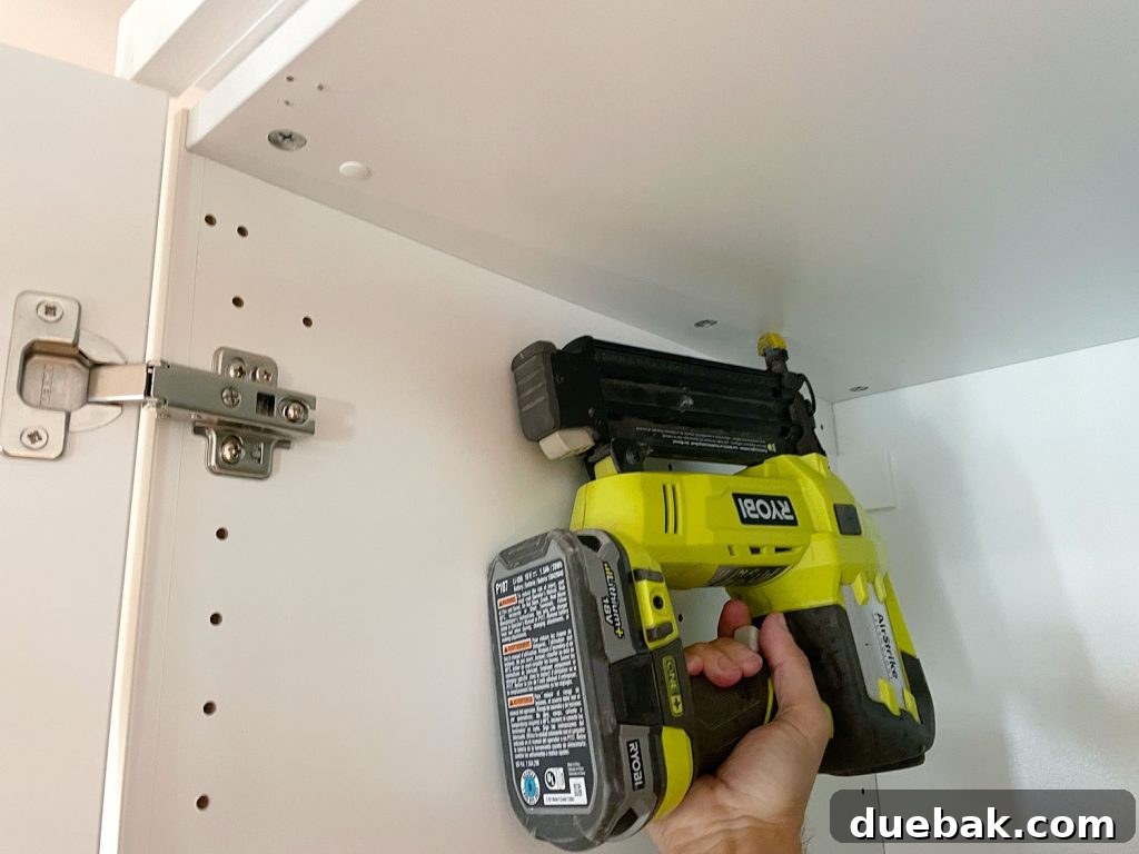 Ikea Pax Built-In: Seamless Style Transformation 15 Nailing Backer Piece To Top Of Ikea Wardrobe Using Nail Gun