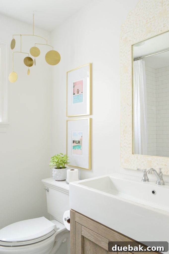 Bright modern bathroom with wood vanity and gold accents
