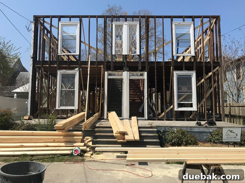 Duplex renovation photos of home stripped to framing