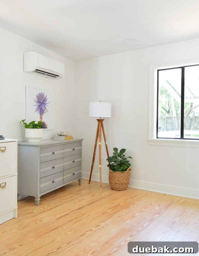 Before photo of bedroom corner with random dressers in corner