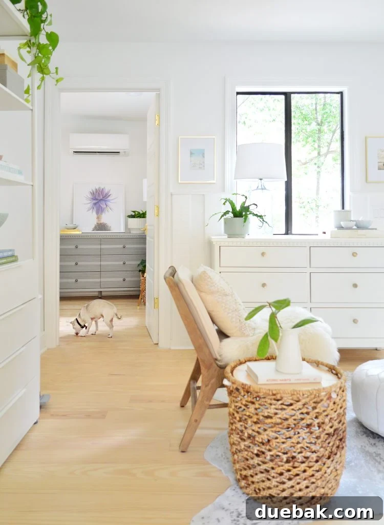 Before photo of bedroom as seen from kitchen with random dressers