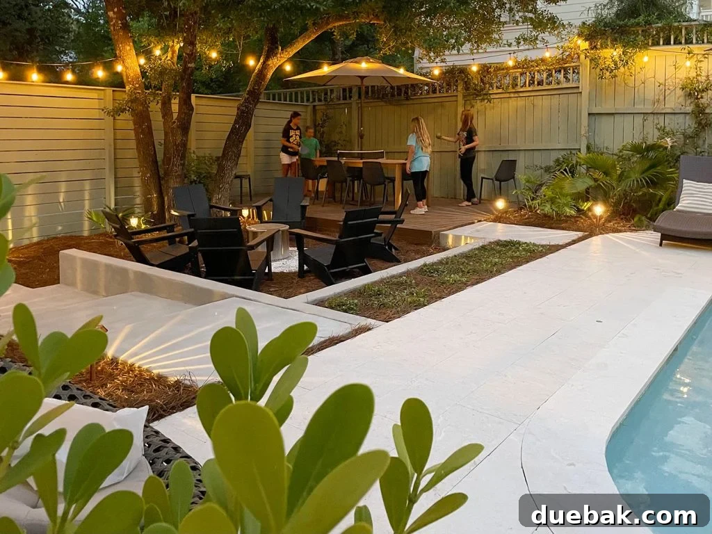 Backyard Pool Area With Kids Playing Ping Pong On Dining Table