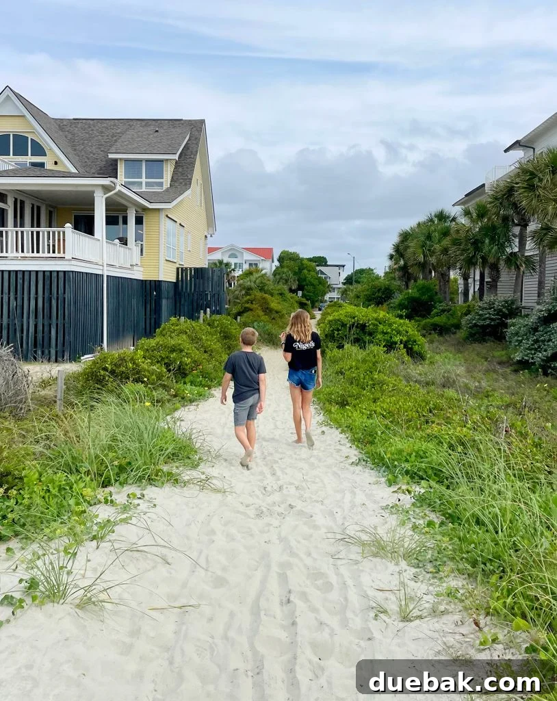 Children Walking Down Beach Access At Isle Of Palms South Carolina