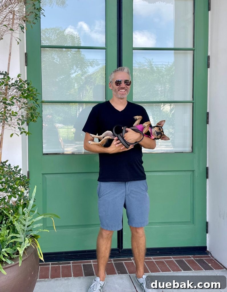 John Holding Penny The Chorkie In Charleston South Carolina
