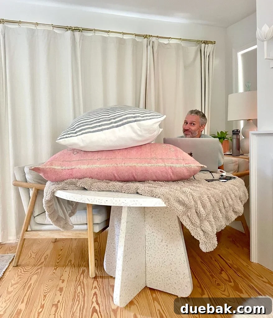 John Sitting Behind Pillows For Podcasting Record